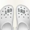 Jibbitz-skovedhæng med tallet 0